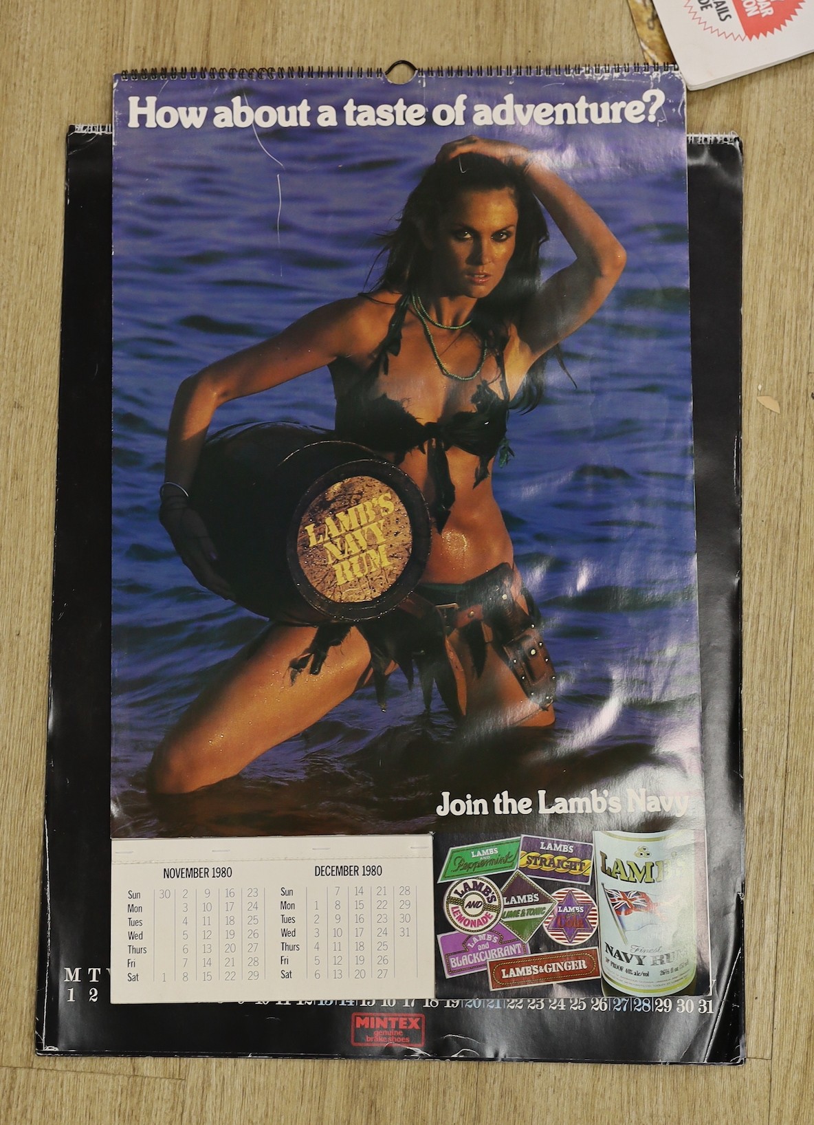 A collection of seven Pentax, seven Lamb’s Navy Rum, seven Unipart, eight Mintex and other “pin up” style calendars